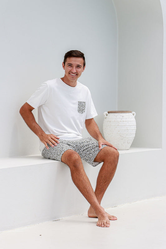 man sitting down wearing leopard print pyjamas pj's pajamas