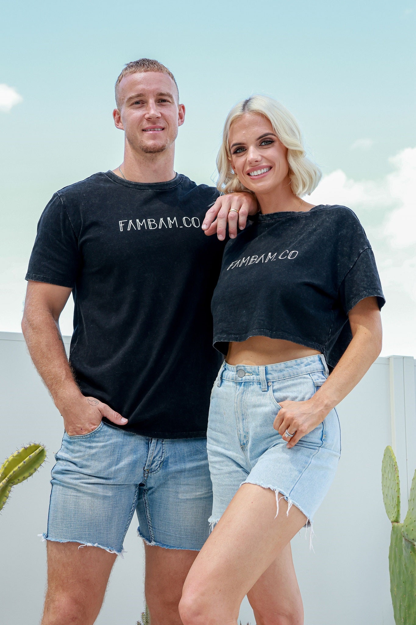 Couple standing together wearing matching shirts