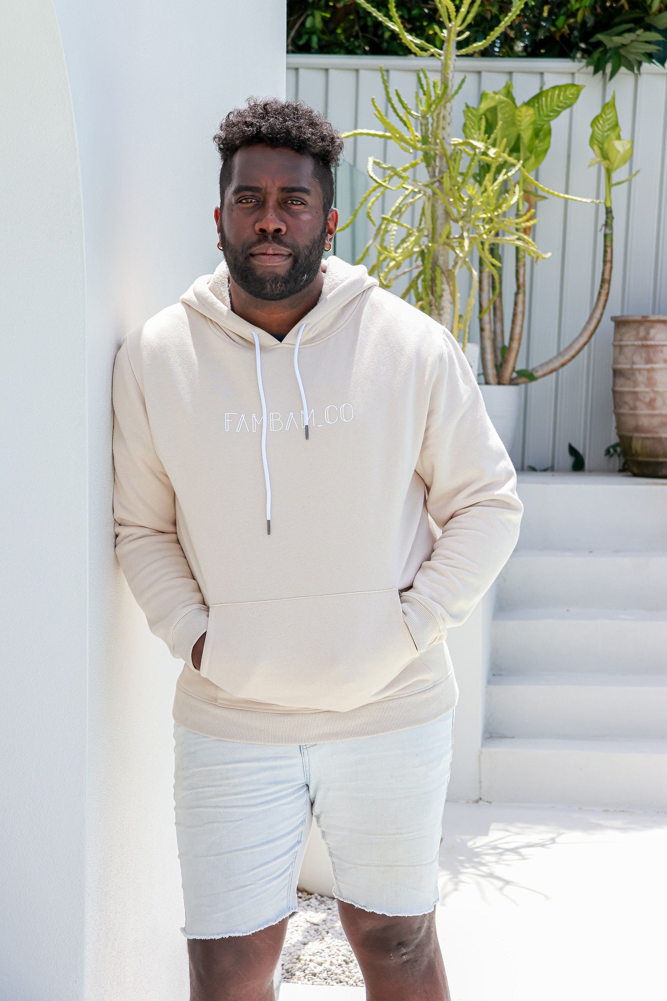 standing matching in beige hoodie jumpers