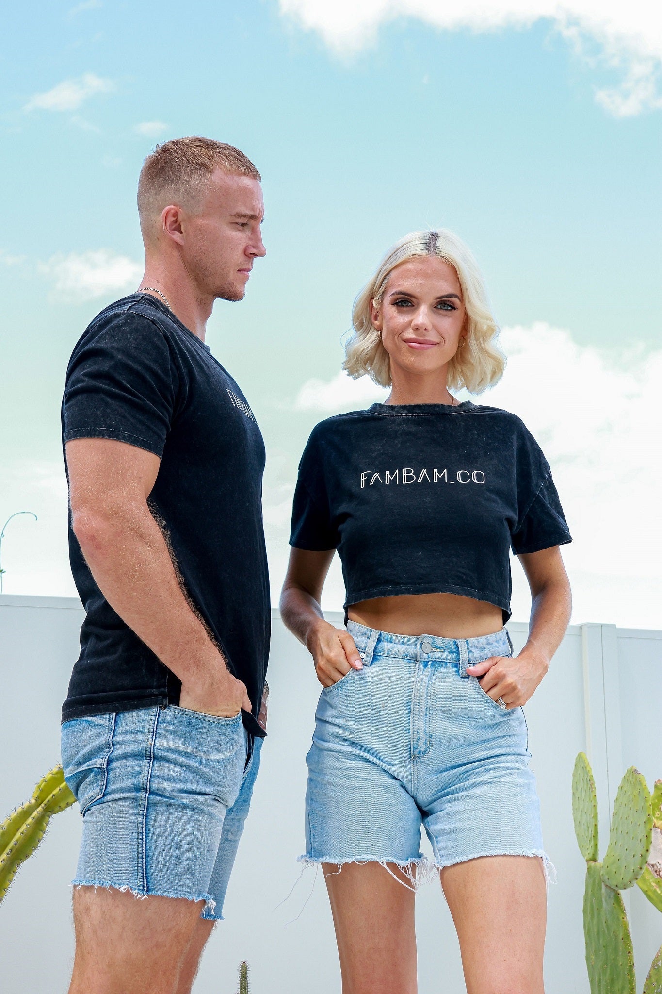 Couple standing together wearing matching shirts