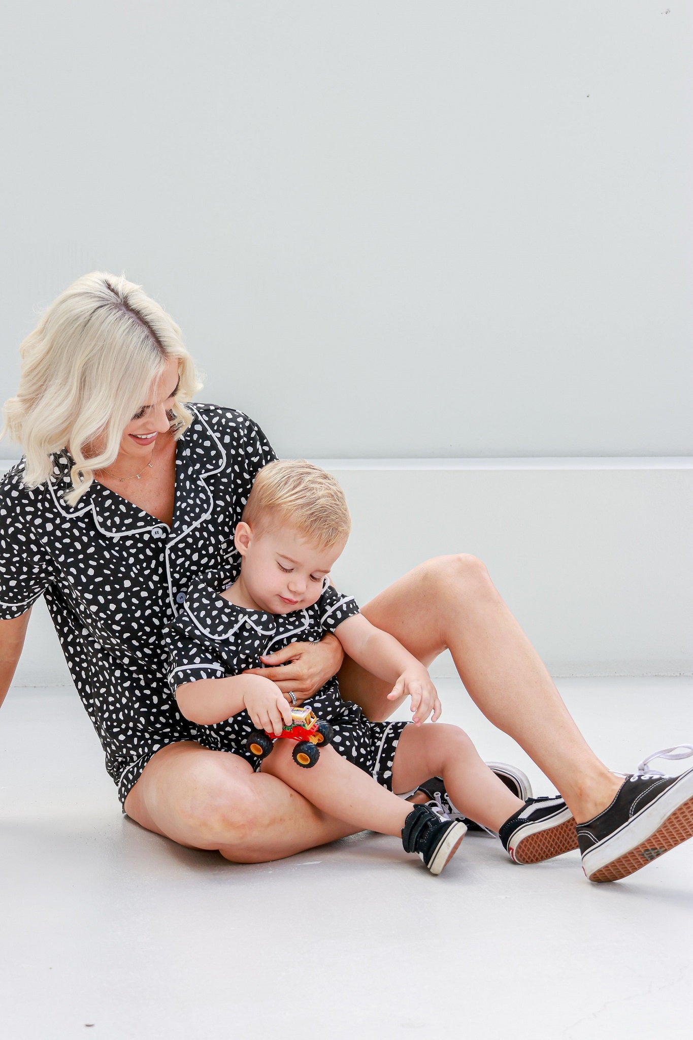 mother and son hanging outside together in matching pyjamas pj's pajamas