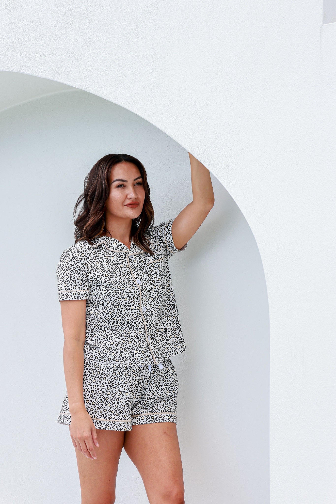 woman standing down wearing matching leopard print pyjamas pj's pajamas