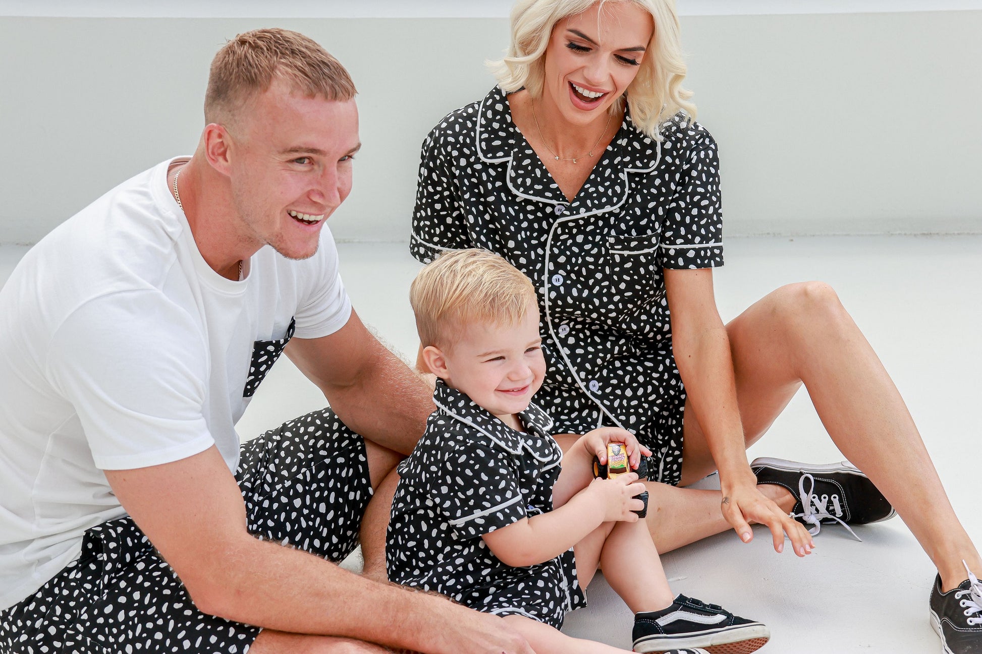 Dad, Mum and bub playing outside with toy car wearing matching pyjamas PJ's pajamas sets