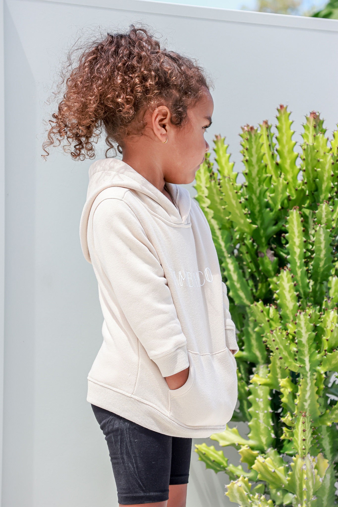 girl wearing unisex jumper hoodie in beige