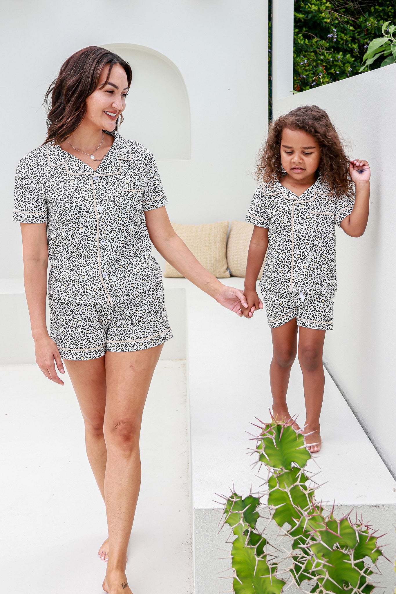 mother daughter holding hands wearing leopard print pyjama sets pj's pajamas